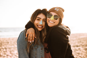 best friends are enjoying day out sun sunny beach colorful and best spf for face and nose looking stylish cute colorful happy protecting skin from sun can swim reef safe sunscreen and environmentally safe that contain zinc oxide